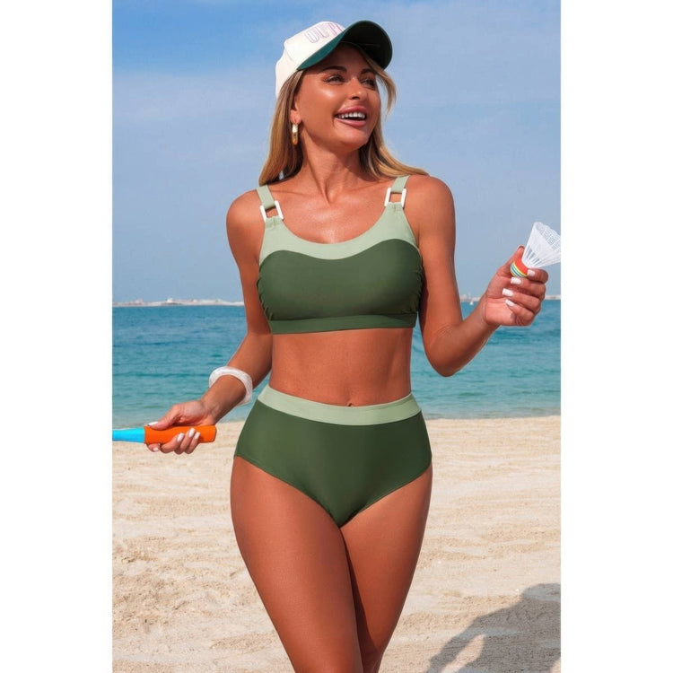 Woman in green bikini and cap on a beach